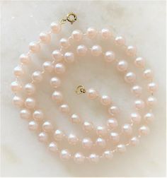 "Natural Faux Pearl Necklace with Gold Tone Spring Ring Clasp Pearls Measure 8mm in Diameter ( 1/4\" in Diameter ) Mot Pearls are Natural Pearl Color 16\" 7.00 18\" 8.50 24\" 9.50 29\" 10.50 36\" 10.50 Endless ( without clasp ) 46\" 11.00 Endless ( without clasp ) COMPLIMENTARY DOMESTIC SHIPPING" Pink Single Strand Round Jewelry, Pink Round Single Strand Jewelry, Classic Round Hypoallergenic Necklace, Adjustable Feminine Jewelry With Round Beads, Feminine Pearl Chain Jewelry With Round Beads, Classic Pink Pearl Chain Jewelry, Elegant Nickel-free Jewelry With Round Beads, Feminine Gold Jewelry With Round Beads, Feminine Gold Round Beaded Jewelry