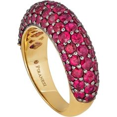 Looking for a statement piece that will turn heads? Look no further than this stunning Small Dome Ring in Ruby by Piranesi. With approximately 3.0 carats of round rubies, this ring is sure to catch the eye of anyone who sees it. The rubies are set in a unique combination of 18K yellow and black gold, creating a bold and elegant contrast that is truly one of a kind.Not only is this ring a beautiful piece of jewelry, but it also speaks to the desires of our target market. Women who buy fine jewelr Luxury Pink Sapphire Ring With Pave Setting, Luxury Ruby Jewelry With Pave Setting, Pink Sapphire Ring With Pave Setting, Luxury Ruby Ring With Pave Setting, Luxury Ruby Ring With Round Cut Gemstone, Pink Sapphire Rings With Pave Setting, Exquisite Yellow Gold Ruby Ring, Formal Yellow Gold Ruby Ring With Pave Setting, Formal Pink Sapphire Ring With Pave Setting