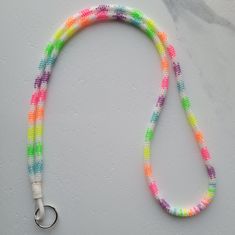 a multicolored beaded lanyard with a metal hook