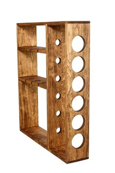 a wooden shelf with holes in it