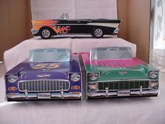 two toy cars are sitting on a table