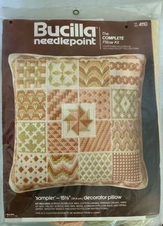 the needlepoint pillow is in its package