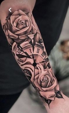 a man with a clock and roses tattoo on his arm