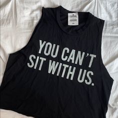 Brand New With Brandy Melville Muscle Tee “You Can’t Sit With Us” Black Muscle Tee With Letter Print For Summer, Casual Black Muscle Tee With Graphic Print, Black Muscle Tee With Letter Print Crew Neck, Summer Black Muscle Tee With Letter Print, Graphic Tee For Workout Black Top, Graphic Tee For Workout In Black, Black Crew Neck Muscle Tee With Letter Print, Casual Black Graphic Muscle Tee, Casual Black Graphic Print Muscle Tee