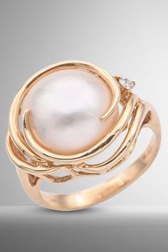 Indulge in timeless elegance with this Vintage 14K Yellow Gold Cocktail Ring. Adorned with a captivating Mabe Pearl and glistening Diamonds, it's a statement of sophistication. Size 6. #VintageFashion #GoldJewelry #PearlAndDiamonds Pearl Diamond Ring, Antique Rings Vintage, Yellow Gold Cocktail Ring, Diamond Cocktail Ring, Mabe Pearl, Pearl And Diamond Ring, Gold Cocktail Ring, Gold Cocktail, Diamond Cocktail Rings