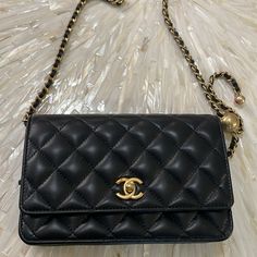 Chanel Black Leather Chain Wallet With Gold Clasp And Gold/Black Chain. Never Worn. Excellent Condition. Luxury Travel Evening Bag With Chain Strap, Luxury Clutch Wallet On Chain For Travel, Formal Black Wallet On Chain With Removable Pouch, Rectangular Black Clutch For Everyday Luxury, Black Rectangular Wallet On Chain For Evening, Designer Evening Wallet On Chain Crossbody, Designer Crossbody Wallet On Chain For Formal Occasions, Luxury Wallet On Chain Clutch For Travel, Luxury Wallet On Chain With Detachable Strap For Everyday