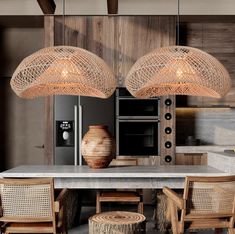 a kitchen with wooden chairs and lights hanging from the ceiling