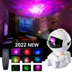 the remote control is in front of an image of a spaceman with colorful lights