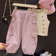 Product ID: BB51458  Material: 90% Cotton  Color: Apricot, Pink      Size Chart        Size (Age)     Height (CM)     Chest (CM)     Waist (CM)       18-24M  86-95  50  40     2-3T  95-105  53  42     3-5T  105-115  56  44     5-7T  115-125  59  46     7-9T  125-135  62  48     9-11T  135-145  65  50      *It's recommended to choose the size that corresponds to your mini's height and body measurements for a much more accurate fit. Please also take delivery time into consideration.  *The parcel only contains the tank top or pants. Other pieces or accessories shown are only used for photo props. Cargo Vest, Kids Outfits Girls, New Girl, Summer Casual, Printed Shorts, Cargo Pants, Outfit Sets, Pants Set, Girl Outfits