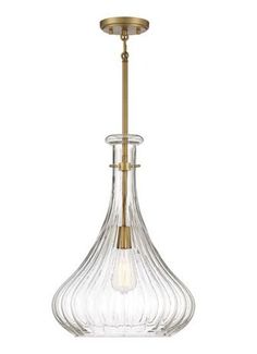 an antique brass and clear glass pendant light with a single bulb hanging from the ceiling