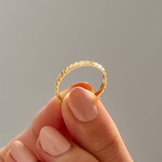 a person holding a ring in their hand