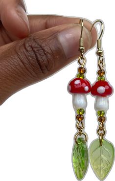 Funky Handmade Dangle Jewelry, Fun Mushroom Design Jewelry For Gifts, Fun Mushroom Design Jewelry Gift, Funky Adjustable Dangle Earrings, Adjustable Green Earrings With Mushroom Design, Adjustable Green Mushroom Design Earrings, Green Adjustable Mushroom Design Earrings, Whimsical Adjustable Beaded Dangle Earrings, Funky Red Handmade Jewelry