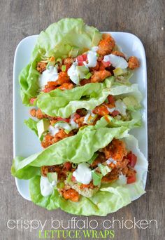 lettuce wraps with chicken and ranch dressing on them are ready to be eaten