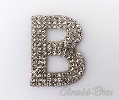 the letter b is made up of small crystals