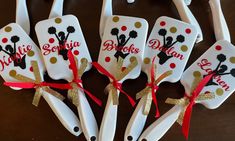 six personalized toothbrushes with gold and red bows