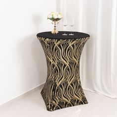 Quantity: 1 Cocktail Table Cover Material: Sequin on Spandex Color: Black | Gold Style: Sparkly Wave Pattern Fits: Standard Cocktail Table Table Diameter: 30”- 32” Table Height: 40”- 42” Thickness: 160GSM Serged seams and hemmed edges to prevent fraying Foot Pockets: Yes Features: High Quality 4-way Stretchable Spandex, Wrinkle & Stain Resistant InformationAdditional Information: For Tablecloth only, other decorative accessories are not included How to Care: Hand wash or spot clean with a soft d Folding Chair Covers, Evening Gala, High Top Tables, Sequin Backdrop, Stylish Curtains, Gold Waves, Burlap Lace, Table Skirt, Table Table