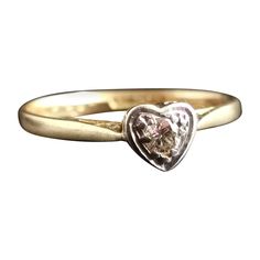 A pretty and romantic vintage Diamond heart ring. Crafted from rich 18kt yellow gold, Diamond and platinum in an Art Deco style. It has a rich 18kt yellow gold band leading up to the front platinum setting, it is designed as a heart with the single brilliant cut diamond set into an illusion setting. It is stamped to the band 18ct and Plat, English make C1960s. This would make a perfect engagement ring or an amazing gift for someone Special. Approx sizes: UK size K½ US size 5⅜ EU / MM 50.27 Weigh Diamond Heart Ring, Vintage Heart, Perfect Engagement Ring, Art Deco Style, Gold Platinum, Vintage Diamond, Jewelry Rings Engagement, Diamond Heart, Deco Style