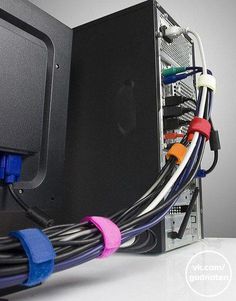 the back side of a computer with wires connected to it