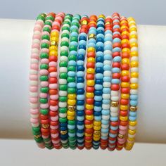 Complete Sunshine Collection Colorful Stackable Boho Seed Bead Stretch Bracelets Set of 12 - Etsy Cheap Multicolor Single Strand Beaded Bracelets, Cheap Flexible Multicolor Beaded Bracelets, Cheap Rainbow Beaded Bracelets With Tiny Beads, Multicolor Stackable Friendship Bracelets With Round Beads, Everyday Rainbow Colored Beaded Bracelets, Everyday Rainbow Beaded Bracelets, Fun Rainbow Beaded Stretch Bracelet, Casual Rainbow Beaded Bracelets, Multicolor Stackable Stretch Bracelet With Round Beads