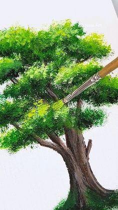 someone is drawing a tree with colored pencils