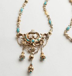 A stunning Georgian era 15K gold festoon necklace with a matching chain in beautiful turquoise and white enamel. Quite rare to find an enameled chain such as this. The workmanship is gorgeous. The center of the necklace measures 1-7/8" wide by 2" tall including the dangles. Necklace is a size 16-1/2" and in superb condition. Total weight is 7.2 grams. Swiss in origin. A beautiful piece of Georgian jewelry. Festoon Necklace, Georgian Jewelry, Georgian Era, Wedding Jewellery Necklace, Wedding Necklaces, Gold Enamel, Style Expert, White Enamel, Wedding Necklace