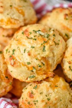 some biscuits are piled on top of each other with parsley sprinkles