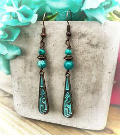 These have Kokopelli Fertility Charms with a turquoise serpentine beads, very tribal southwestern vibe Southwestern Style Turquoise Earrings For Festival, Southwestern Turquoise Earrings For Festival, Adjustable Bohemian Patina Earrings, Southwestern Style Blue Hallmarked Jewelry, Bohemian Patina Earrings, Southwestern Turquoise Beaded Earrings, Nickel Free, Bohemian Turquoise Beaded Nickel-free Earrings, Nickel-free Blue Southwestern Earrings, Bohemian Turquoise Hand-tooled Earrings