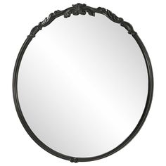 a round mirror with an ornate design on the top and bottom edge, in black