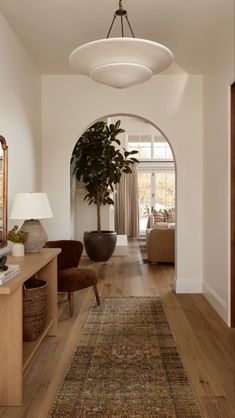 the hallway is clean and ready for us to use as an entrance way in this home