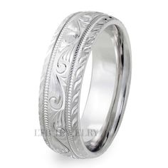 an intricately engraved wedding ring in white gold