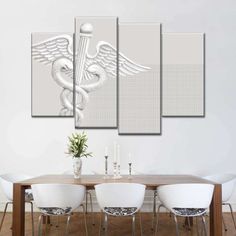 a dining room table with four chairs and a large white medical symbol on the wall