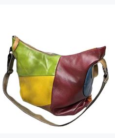 a multicolored leather purse on a white background