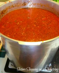 a pot of soup sitting on top of a stove