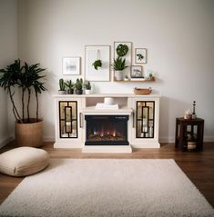 a living room with a fire place and potted plants