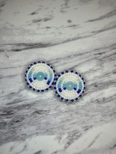 Handmade beautiful beaded earrings. Blue seed beads size 11/0 sewn on stiffened felt, showcasing a gorgeous blue centre/ cabochon attached with white faux suede and a stainless steel lever back/hinge post. I tried to do a little ombré effect with different shades of blue. Gorgeous.  Large size earrings, size is 1 1/8"  Great for every day or a special occasion.  Perfect for a gift or keep it as a gift to yourself.  Care Instructions: Do not get wet, remove before showering or swimming. Store out Beautiful Beaded Earring, Blue Beaded Earrings, Handmade Earrings Beaded, Ombre Effect, Wedding Jewelry Earrings, Blue Ombre, Wedding Earrings, Wooden Beads, Pale Blue