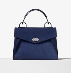 PROENZA SCHOULER Suede Small Hava Top Handle Bag Indigo Length: 6.5" Width: 3.5" Height: 7" Handle drop:4.5" Strap length: 34.5" / 19" drop. This chic bag is crafted of soft suede leather in dark blue. The shoulder bag features a suede and leather top handle with a facing V shaped flap pocket, a rear zippered pocket and a polished silver turn lock closure. The flap opens to a black leather interior with a front and patch pocket. This is a splendid satchel for everyday use, from Proenza Schouler. Chic Bags, Handle Bag, Proenza Schouler, Soft Suede, Leather Interior, V Shape, Leather Top, Flap Pocket, Patch Pocket