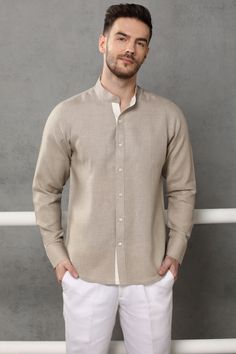 Carry a stunning look in this traditional Nehru collar shirt which is Â homespun in fine quality linen. The  shirt highlights a color block shirt-placket in soft blue color. Classic Flax Shirt With Spread Collar, Flax Classic Shirt With Spread Collar, Classic Collared Shirt In Flax Color, Classic Long Sleeve Flax Tops, Beige Long Sleeve Linen Shirt, Classic Shirt With Relaxed Fit And Stand Collar, Long Sleeve Cotton Shirt In Flax Color, Long Sleeve Flax Cotton Shirt, Shirt Placket