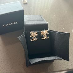 Chanel Cc Earrings With A Bow Brand New With Receipt And The Box The Metal Is Gold With Silver Rhinestones Chanel Earrings Cc, Channel Earrings, Cc Earrings, Chanel Accessories, Chanel Earrings, Chanel Jewelry, Jewelry Brand, Perfume Collection, Silver Rhinestone