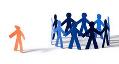 several paper people holding hands in the middle of a circle