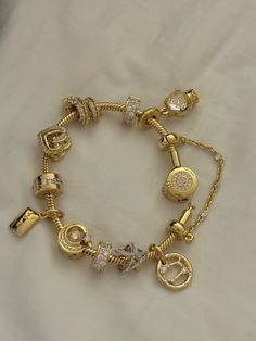 #gold #jewelry #pandora #pandorabracelet #charms #banglestack #beaceletstack Gold Pandora Bracelet Charms, Golden Pandora Bracelet, Pandora Gold Charms, Gold Pandora Charms, Pandora Gold Charm Bracelet, Pandora Bracelet Stack, Pandora Charms Gold, Pandora Bracelet Aesthetic, Pandora Gold Bracelet