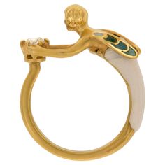 Masriera is a company world-renowned for their amazing enamel work & Art Nouveau reproductions. This 18kt yellow gold Angel Of The Morning ring with "plique-à-jour” and "basse taille” fired enamel depicts an angel holding up a brilliant cut diamond = 0.20 ct. The ring is a size 6.5 . Complimentary signature wrapping & original presentation box included. Each piece of Masriera jewelry is individually numbered and has its own certificate of guarantee. 18KYG Enamel Diamond= 0.20 Ct 8.5-2.7mm Angel Of The Morning, Plique A Jour, Two Tone Engagement Rings, Art Nouveau Ring, Contemporary Engagement Rings, Gold Angel, Blue Sapphire Diamond, Gold Halo, 18k Gold Ring