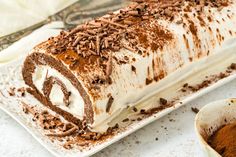 a cake with chocolate and cream frosting on a white plate