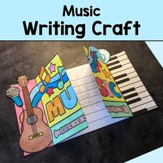 an open book with music writing on it and the words music written in colorful letters