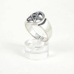 The Pentagram star symbolizes protection, life and health. Sterling Silver. Band width 12 mm at widest point. Comes with meaning card and gift box. There are many Pentagram rings on the market, but few compare to the quality and weight of this Jane Iris Design. Spiritual Star-shaped Ring As A Gift, Happy Solstice, Star Ring, Ring Fit, Beautiful Rings, Statement Rings, Wedding Rings, Band, Engagement Rings