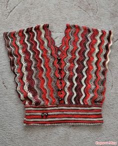 a red and white striped vest hanging on the wall