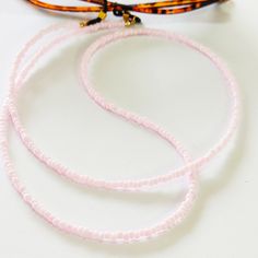 Pink beaded glasses chain, Sunglasses pink cord, Eyewear holder, Sunglasses necklace, Pink glasses holder, Sunglasses strap, Eyeglasses cord Beautiful fashion trend sunglasses beaded string This sunglass strap is lightweight, comfortable to wear and secures your sunglasses on your neck. Fashion trend accessory for the summer! Total length is 70cm / 27.7 inches. Beautifully packaged and ready for gift giving. JEWELRY CARE: Please take care of your jewelry do not wear in the shower, swimming pool, Pink Single Strand Glass Necklace, Trendy Adjustable Pink Beaded Necklaces, Trendy Pink Adjustable Beaded Necklaces, Trendy Pink Adjustable Beaded Necklace, Pink Glass Beaded Necklaces For Gift, Handmade Pink Glass Beaded Necklaces, Adjustable Glass Beaded Necklaces, Pink Glass Beaded Necklace For Gift, Handmade Adjustable Pink Glasses Chains