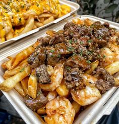 two trays filled with different types of food on top of each other and covered in sauce