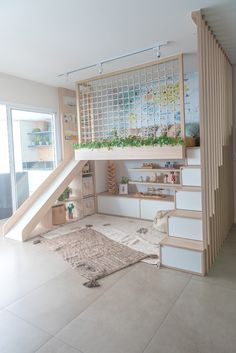 a room with stairs and plants on the wall