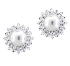 These stunning white south sea pearl diamond-accented omega earrings are a very versatile design. These white earrings are made up of an 18k white gold that gleams beautifully in the light and is set with high-quality diamonds and a white 14mm pearl. Every well-stocked jewelry collection should have a pair of pretty pearl earrings in them. They are formal enough to wear at night for a hot date, or even as bridal jewelry for your big day. We have a feeling that once you add these stud earrings to Sea Pearl, Sea Pearls, South Sea Pearls, South Seas, Pearl Diamond, White Earrings, Pearl Stud Earrings, Diamond Shape, Pearl Studs