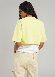 Color: Yellow Cotton jersey Relaxed fit Cropped profile Crew neckline Tonal logo embroidery 100% Cotton Hand Wash Cold By The Frankie Shop. Imported Product Measurements: XS/S- 19" Shoulder, 38" Bust, 14.5" Length M/L- 20" Shoulder, 40" Bust, 15.5" Length Model is 178cm/ 5'10" wearing size XS/S Sporty Cotton Crop Top, Sporty Cotton Crop Top T-shirt, Sporty Cropped Cotton T-shirt, Sporty Cotton Tops For Spring, Yellow Cotton Crop Top With Short Sleeves, Yellow Cotton Short Sleeve Crop Top, Sporty Cotton Short Sleeve Top For Spring, Sporty Short Sleeve Cotton Top For Spring, Yellow Cropped Cotton Top